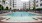 outdoor pool surrounded by lounge chairs