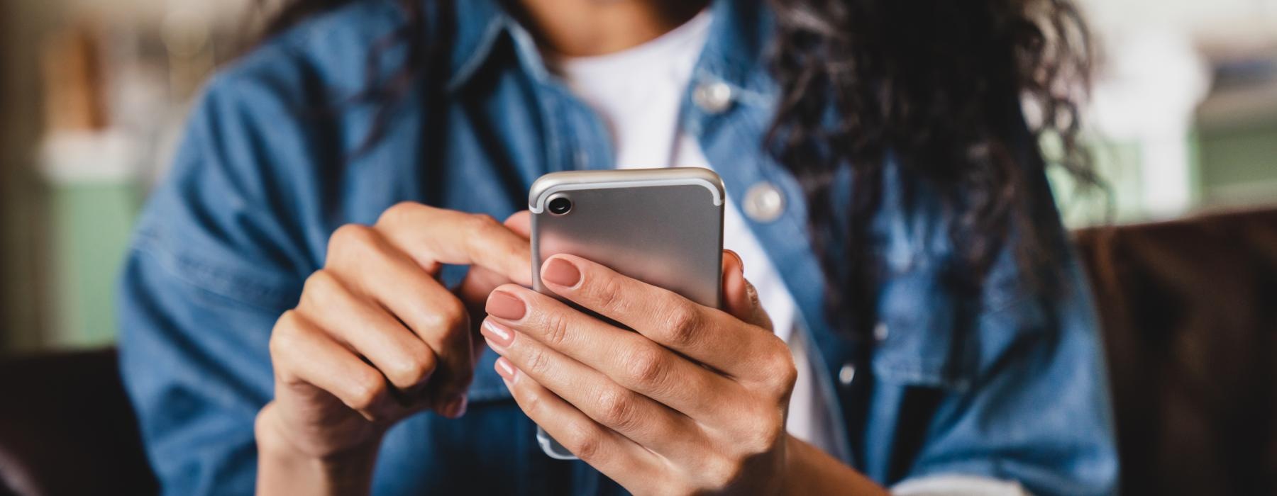 woman texts on her phone