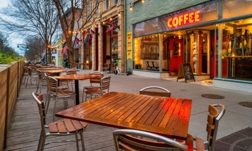 outdoor tables and chairs outside a coffee shop