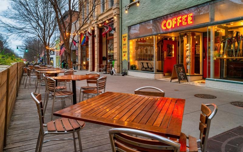 Close to the center of everything outdoor tables and chairs outside a coffee shop