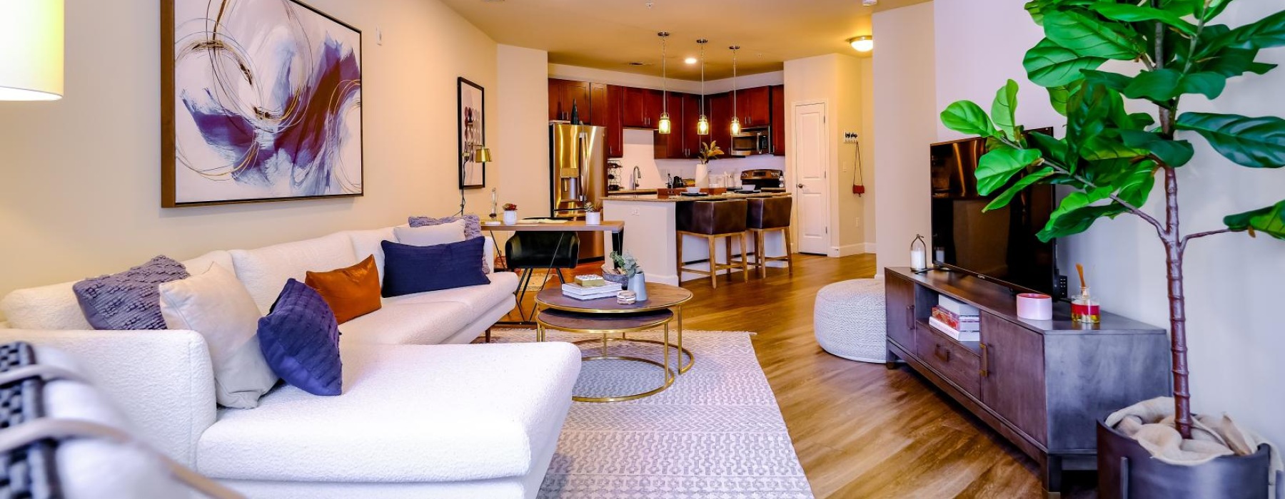 furnished living room open to kitchen