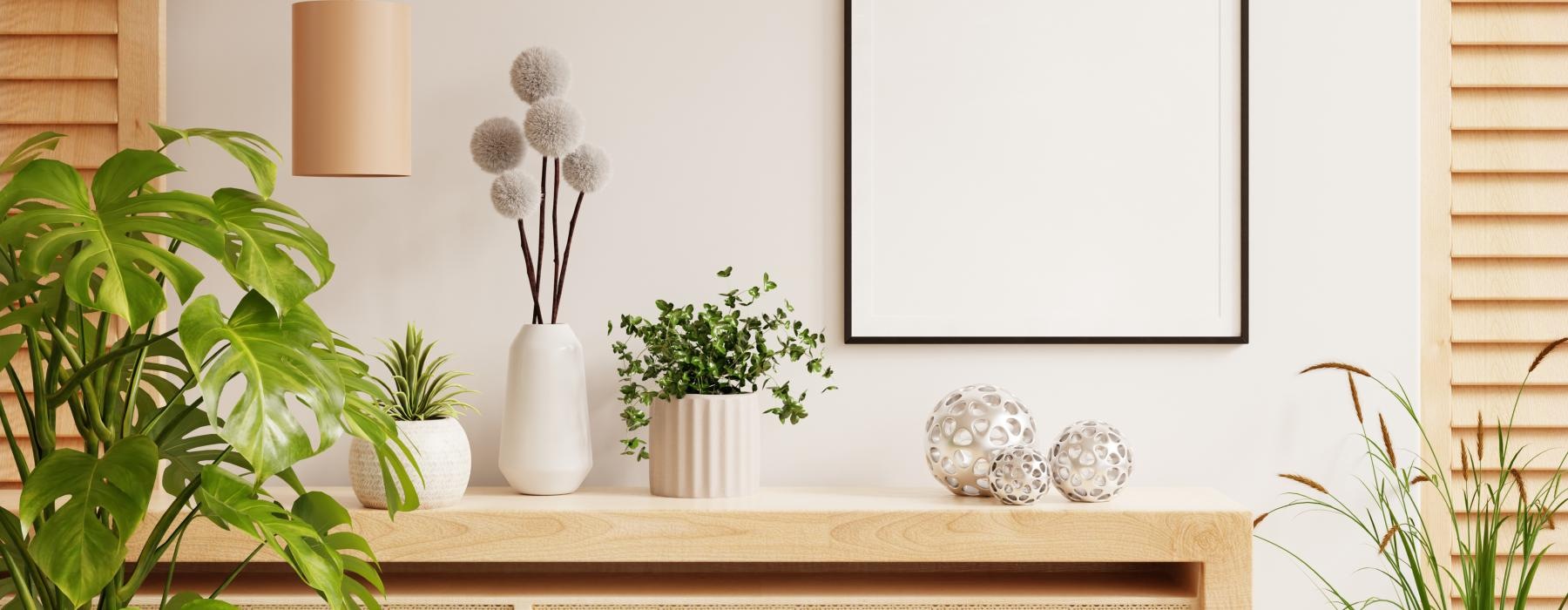 a room with plants in vases on a floating shelf
