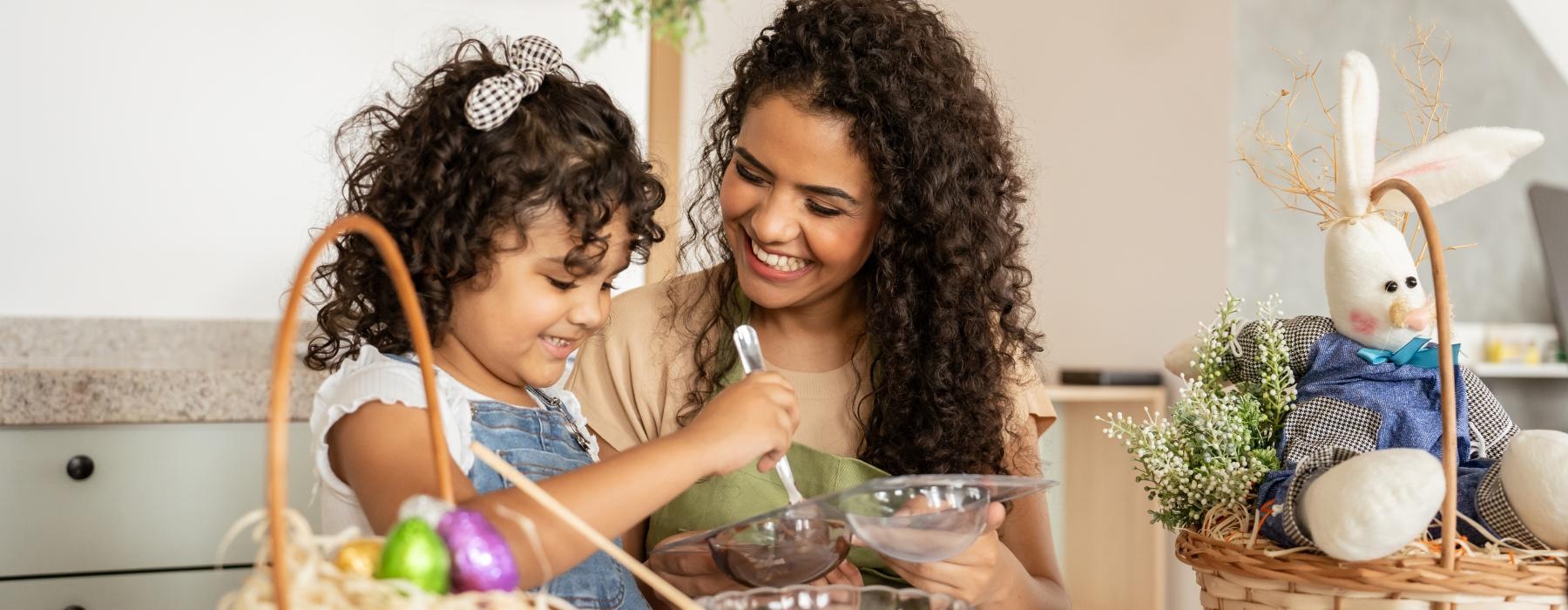 mother and daughter making chocolate in kitchen