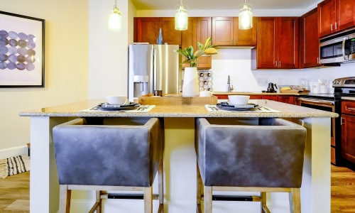 spacious kitchen with pendant lighting over island